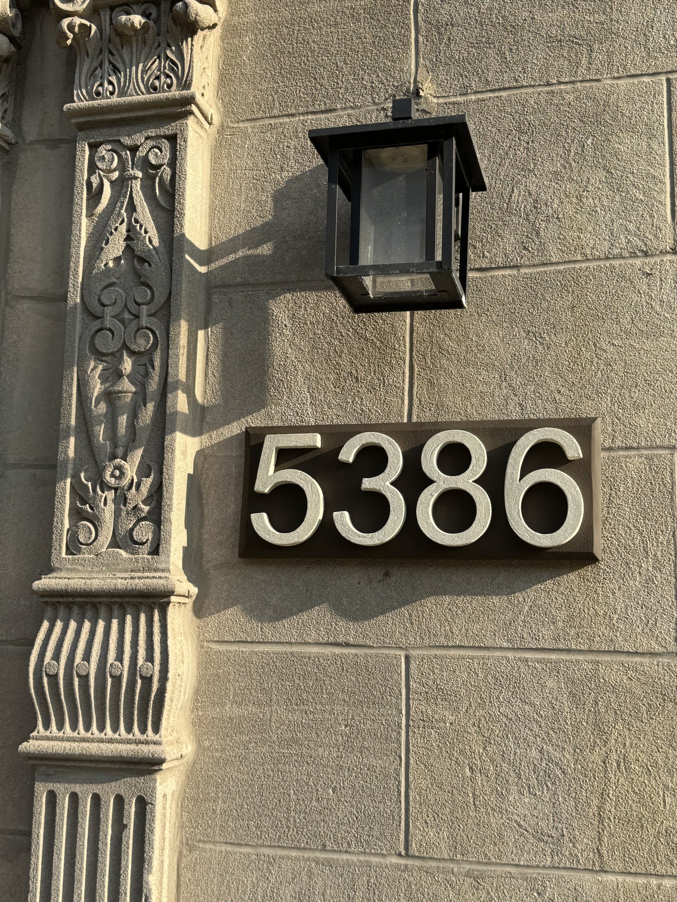 Close view of real installed 5386 GFRC address plaque with raised dimensional numbers